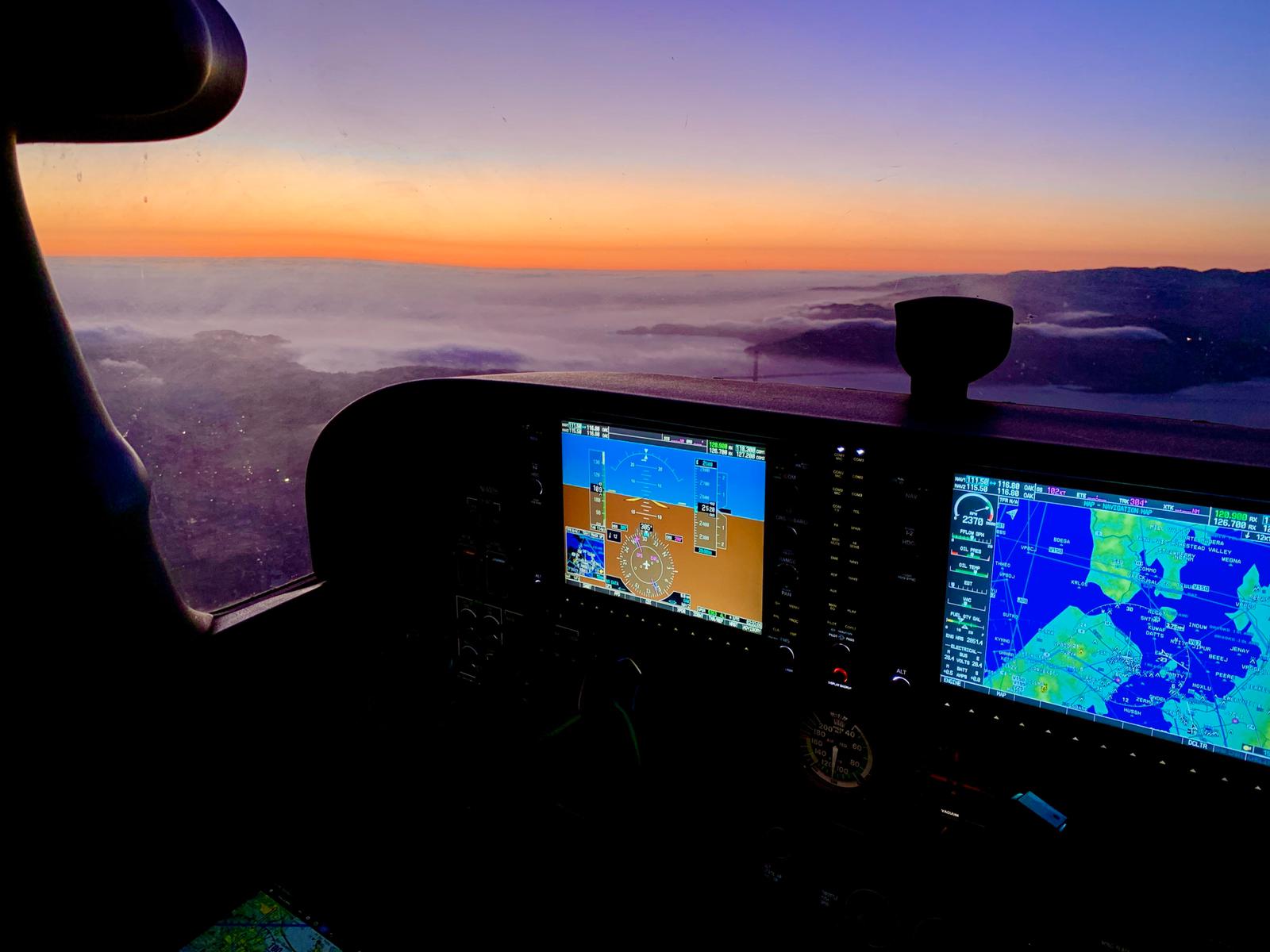 Glass cockpit panel at sunset over the Bay Area
